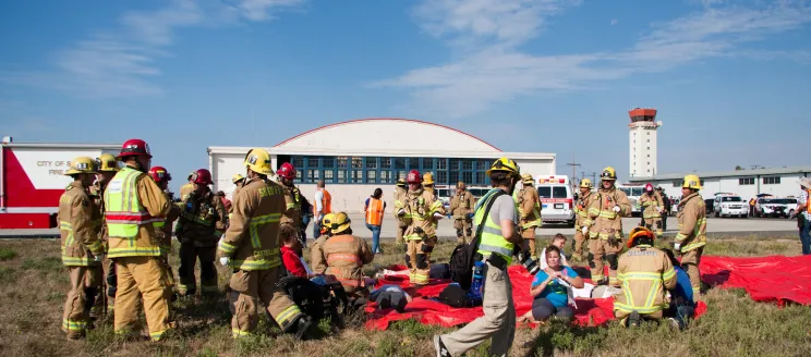 First responders and role-playing emergency "victim" volunteers participate in a live disaster drill 