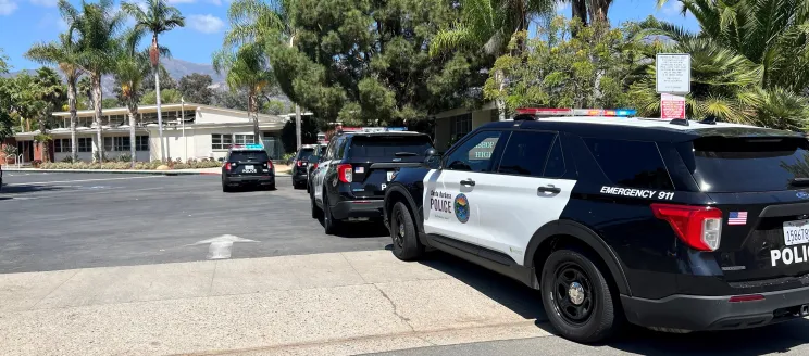 Parked Police Vehicles Bishop Diego HS