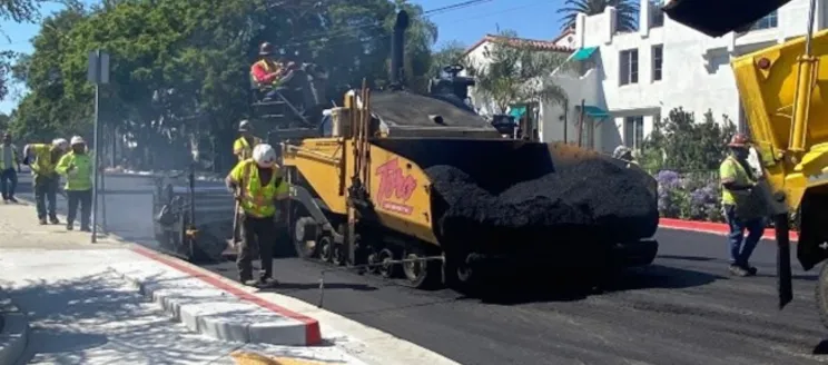 Construction crew paving a City street