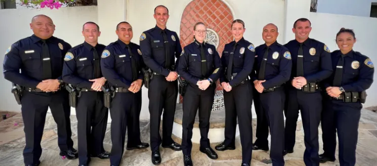 This image shows the 8 newly sworn in Santa Barbara Police Department Officers standing in a line with Chief Kelly Gordon. 