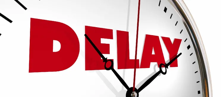 Clock with the word "Delay" in red