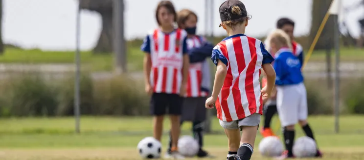 children playing soccer 