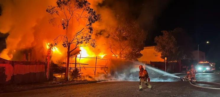 Firefighters extinguish a large structure fire on 700 East Carpinteria St