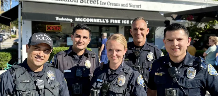 Officers Standing in front of an ice cream shop