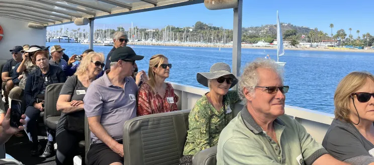 Community members attend a tour on the Land Shark during Creek Week