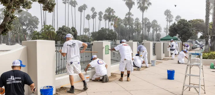 Painters from local companies painting the walls of Skater's Point skatepark