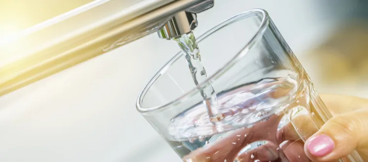 Image of a glass at a faucet