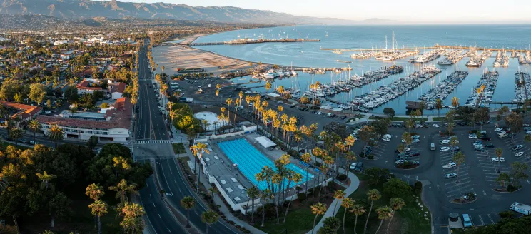 Aerial view of Los Baños del Mar Pool with the city scape and mountains in background