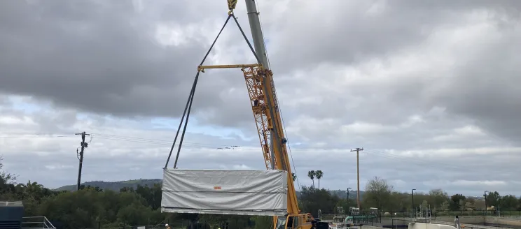Battery storage system being installed by a crane at the Cater Water Treatment Plant