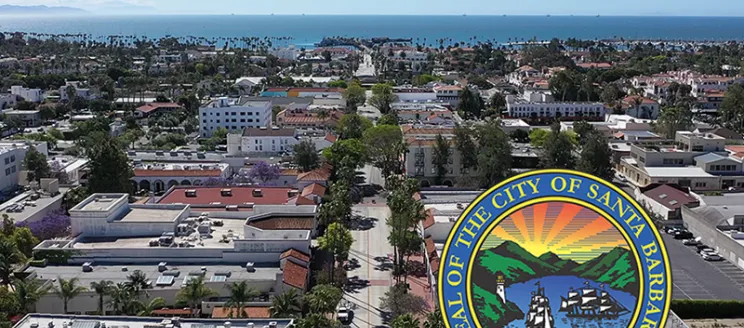 Aerial view of the City and State St going all the way to the ocean with a City Seal in the lower righthand corner