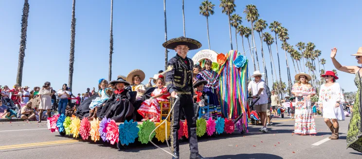 Children's Fiesta Parade colorful float with participants all smiles.