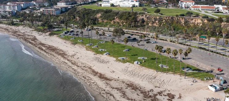 Aerial shot of Leadbetter Beach Park with green grass