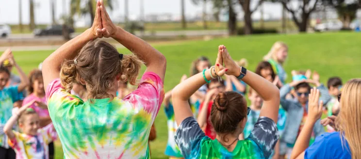 Nature Camp Counselors leading a group at a park