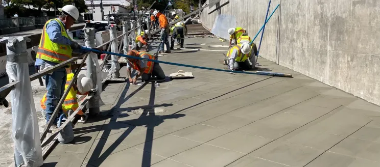 Image of construction workers paving at the State Street Undercrossing