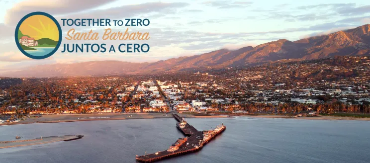 View of Stearns Wharf and Santa Barbara with "Together to Zero" logo 