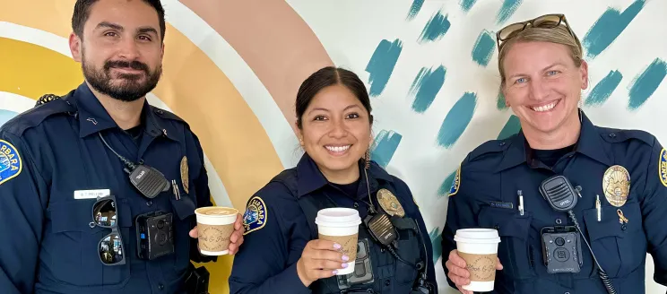 Officers holding coffee cups