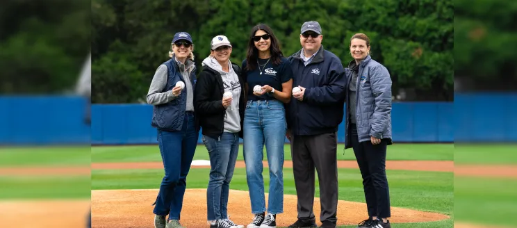 Santa Barbara Airport Staff stand on UCSB Baseball field