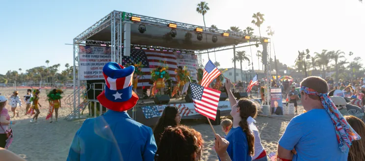 Community members celebrate Independence Day at the West Beach bandstand