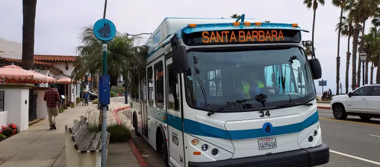 MTD's Downtown-Waterfront Shuttle stopped along the sidewalk.