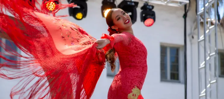 Flamenco dancer wearing a red dress.