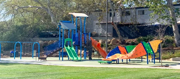 Picture shows a City Park with Playground