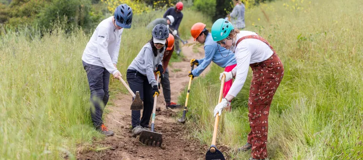 Volunteer trail workers level the dirt on Jesusita Trail