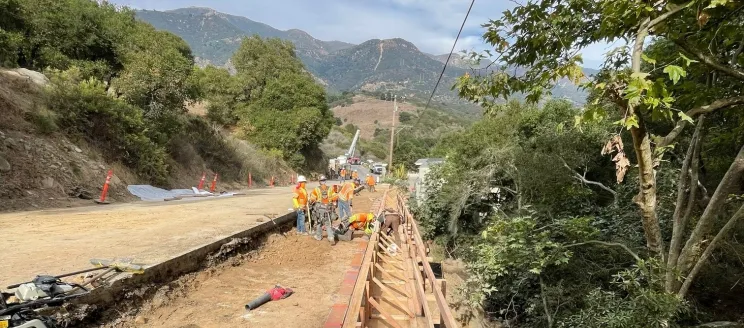 Construction crew at work building a retaining wall along State Route 192 near Parma Park.