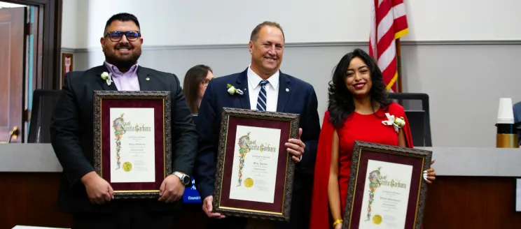 Councilmembers Oscar Guiterrez, Mike Jordan, and Wendy Santamaria holding their Certificate of Election.