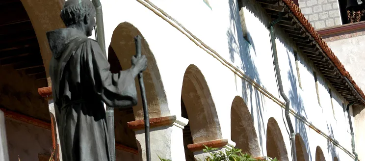 Statue in front of Arches at the Santa Barbara Mission