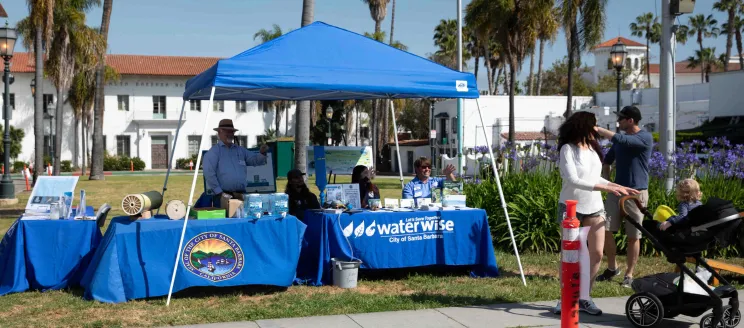 A family being welcomed by Public Works Employees to the Meet and Greet at De La Guerra Plaza.