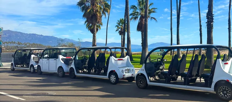 Three State Street Loop golf carts parked along Cabrillo Blvd.