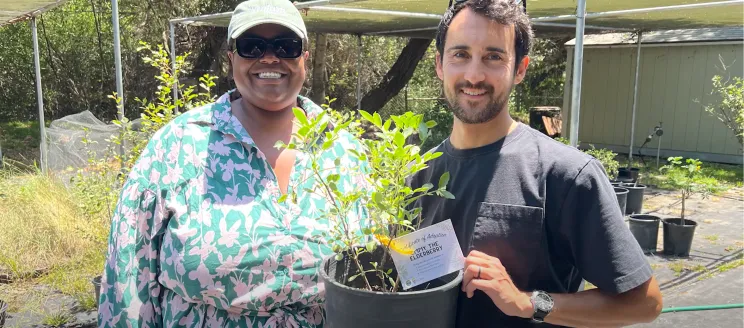 A happy family adopting Emmy the Elderberry tree.