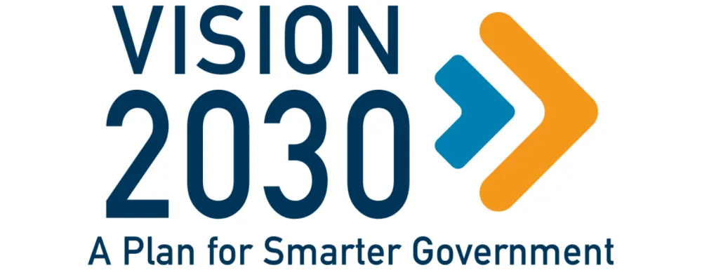 Vision 2030 logo. The words in blue with blue and orange chevron shapes