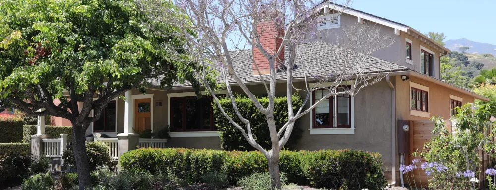 Photograph of a craftsman style 2-story house.