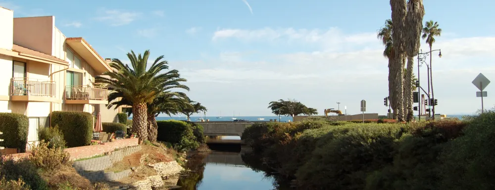 Picture of Sycamore Creek at Cabrillo Boulevard and El Escorial Villas on the left-hand side.