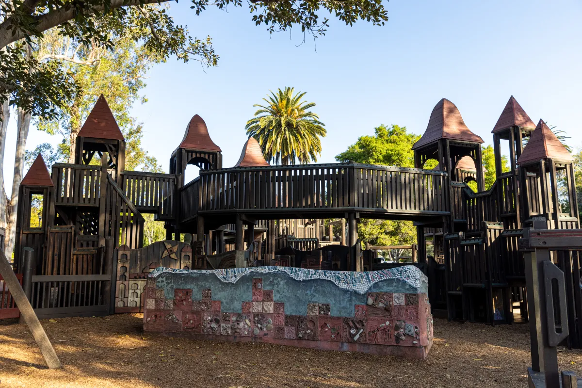 Kids' World wooden play structure with castle-like features