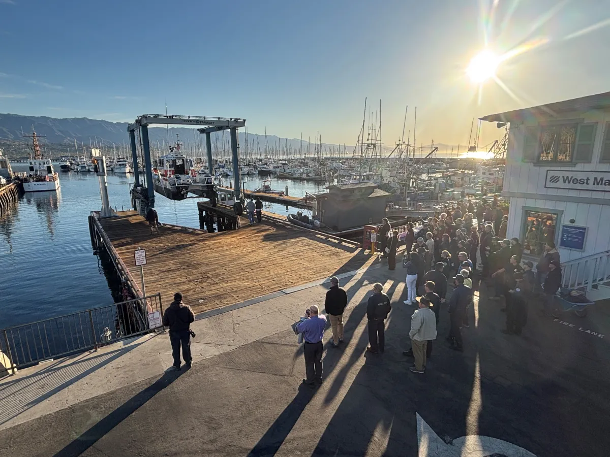 Crowd viewing M2 Catamaran as the sun shines at Travel Hoist Pier