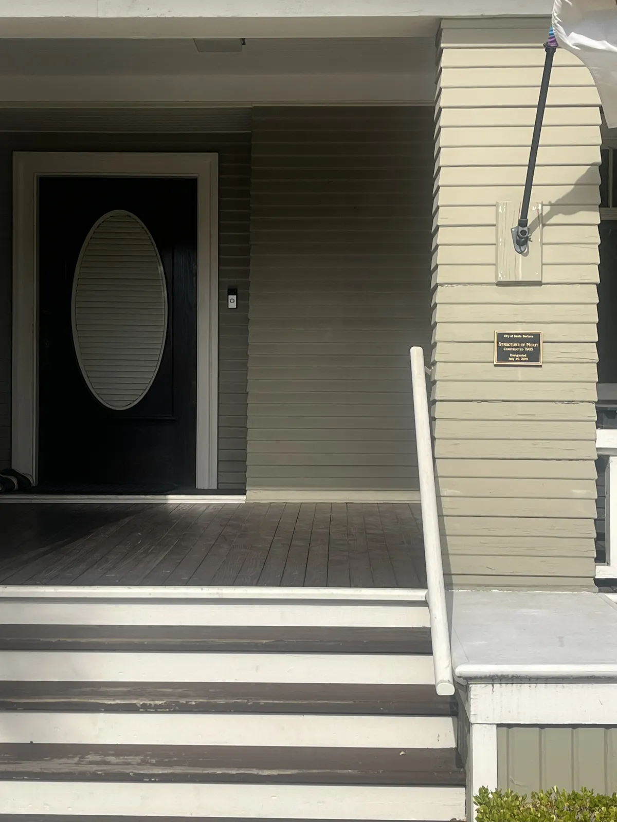 plaque at front entrance of home 212 West Valerio