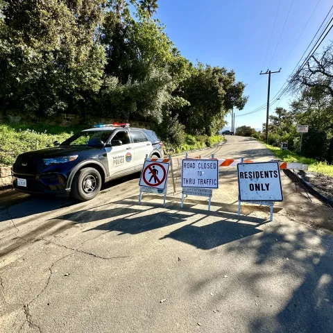 road closed signs with police car