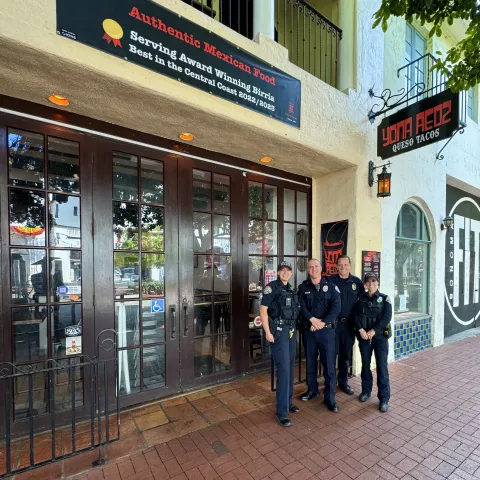 Four Officers Standing in front of Restaurant Yona Redz