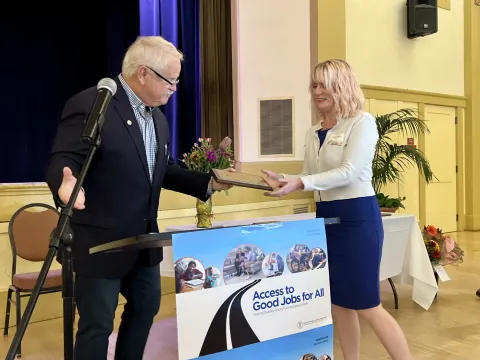 Grocery Outlet Representative accepting an Award from Mayor Rowse.